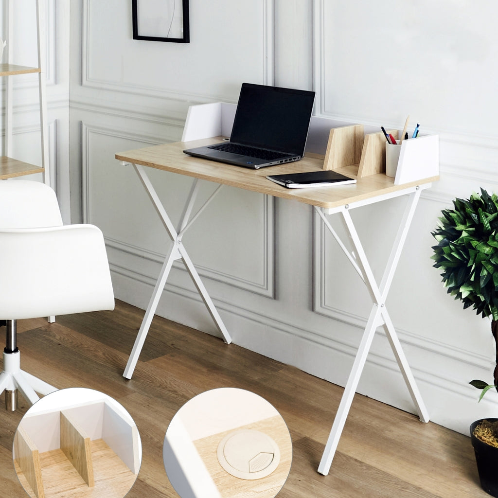 a white desk with a laptop and a chair in a farmhouse style.