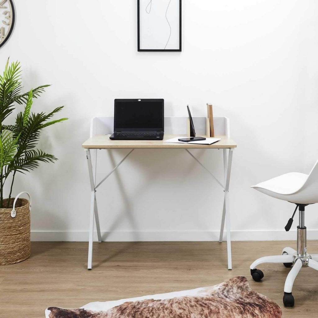 A white desk with a laptop and chair. Wanda computer desk, farmhouse style.