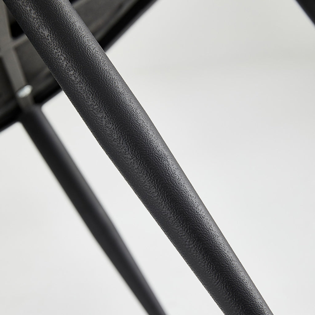 Athlena dining chair black metal leg close up.