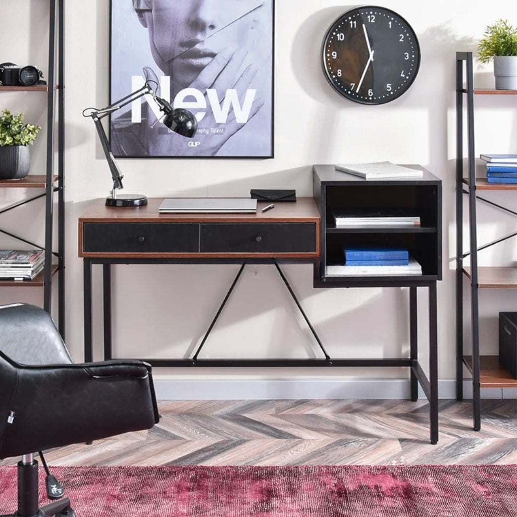 Black and brown Bloomsbury Writing Desk in a workspace with shelves.