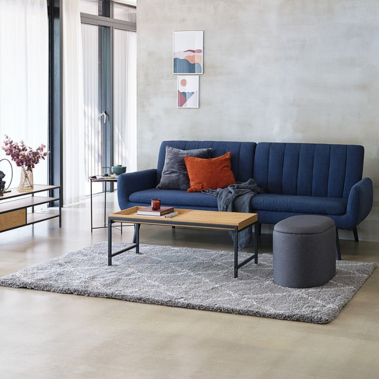 gatwick sleeper sofa with a coffee table and pouf