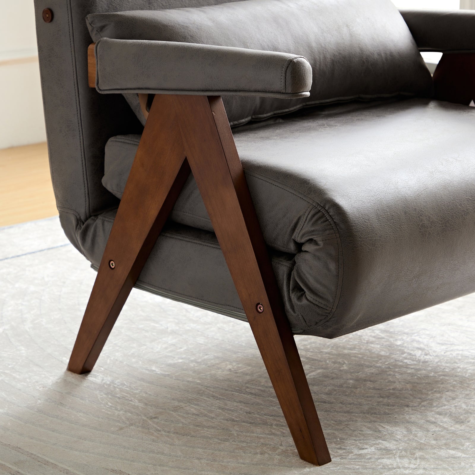 Solid wood chair with gray cushion and wooden legs.