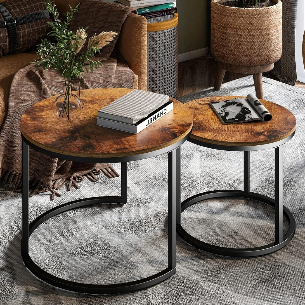 Two round tables with metal legs and wooden tops, suitable for a modern or rustic setting.