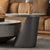 A modern coffee table with a round top and base, part of the Aspen Grey Coffee & End Table Set.