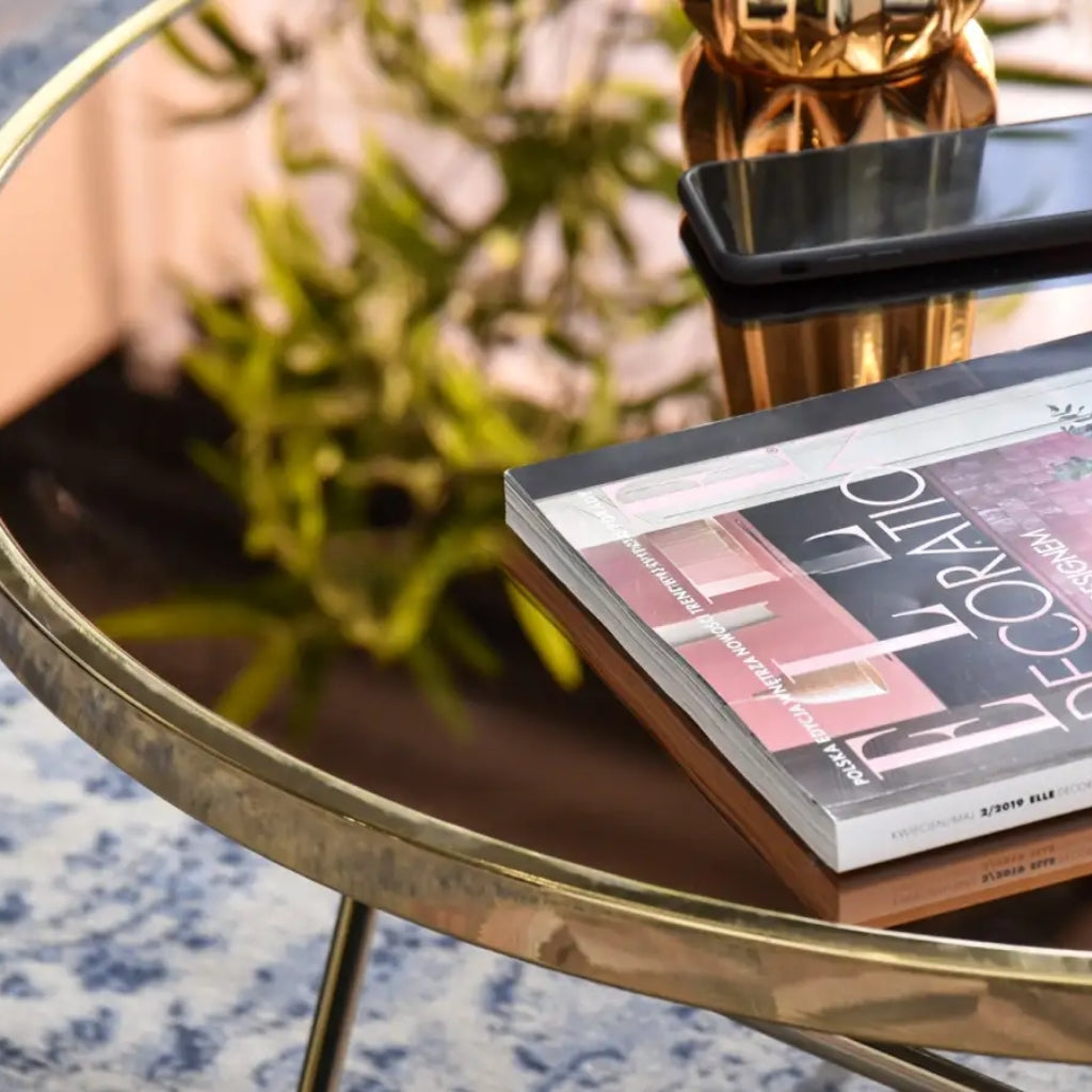 A sleek gold coffee table with a metal frame, perfect for adding a touch of elegance to any room.