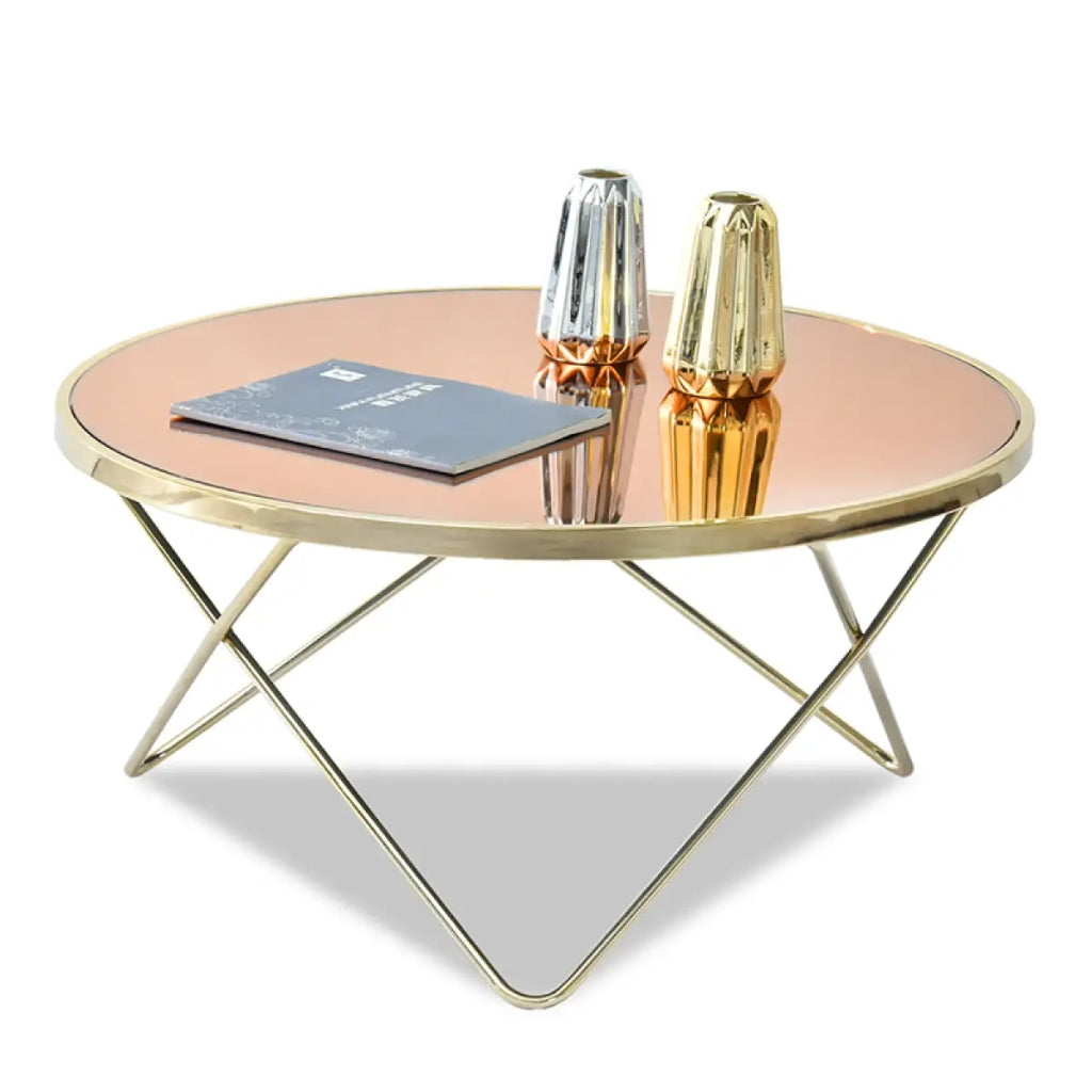 Aden mirror glass coffee table featuring a stylish gold coffee table with a sturdy metal frame.