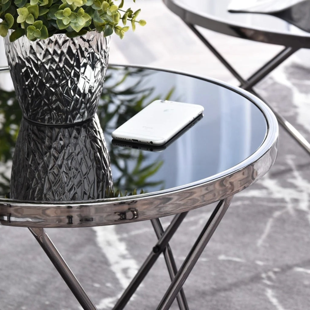 Aden silver End Table with a phone placed on top.