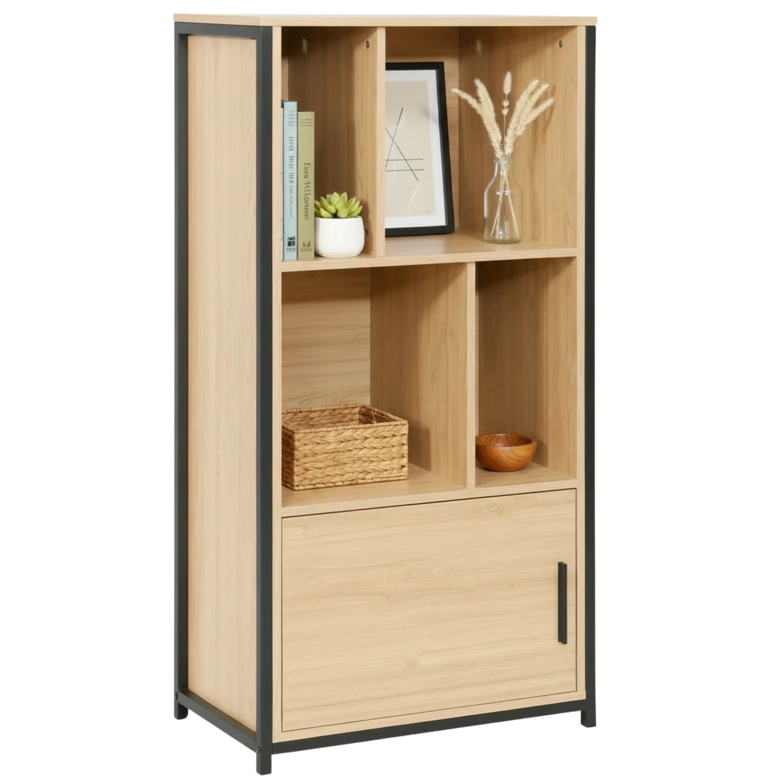 A tall, narrow open bookcase with a light natural wood finish and black metal frame accents. It features four open shelves and a lower cabinet door, styled with books, a small plant, a framed print, a vase, a basket, and a bowl against a plain white background.