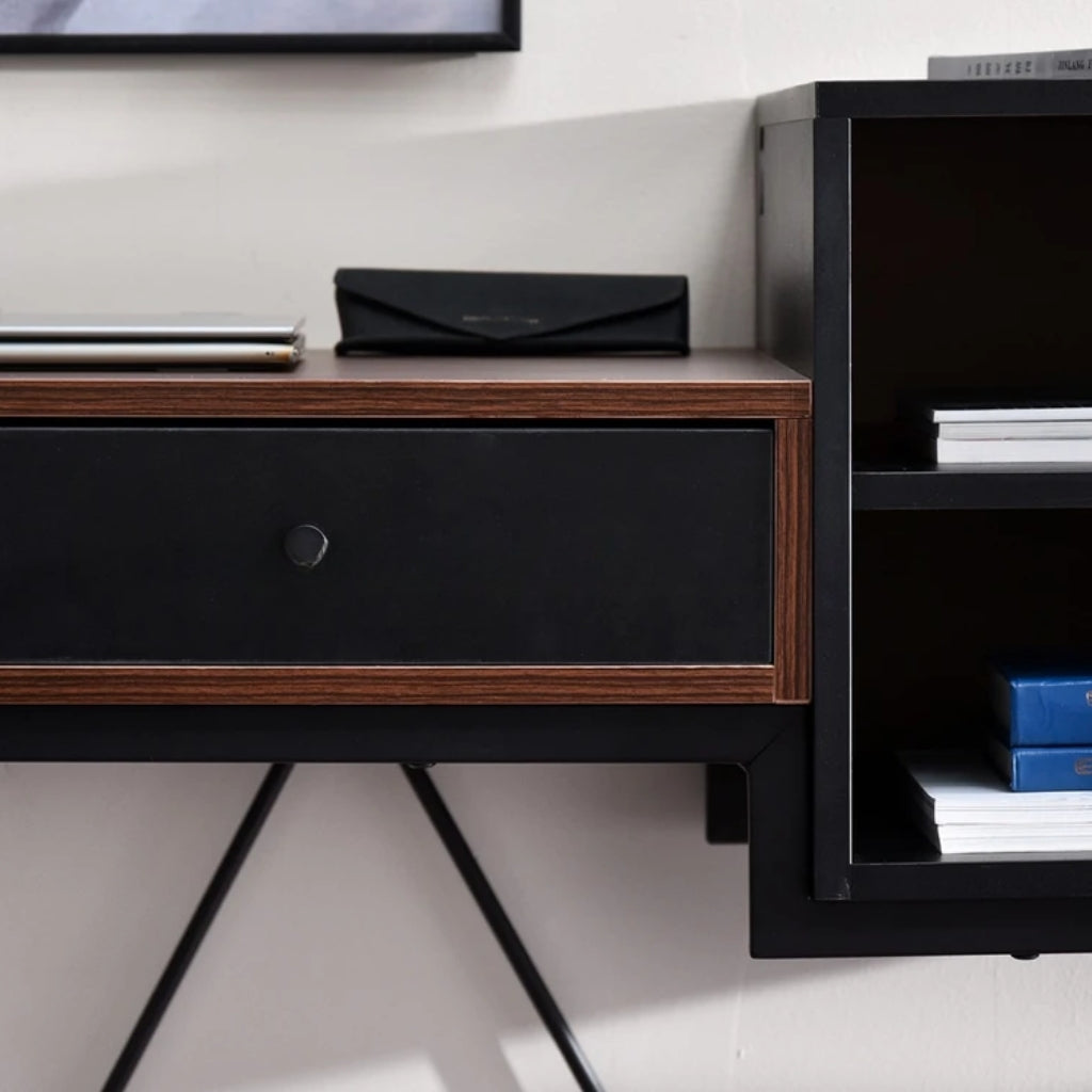 Black and brown Bloomsbury Writing Desk in a workspace drawer close up of dark brown table top, 2 black drawers and 2 storage shelves.