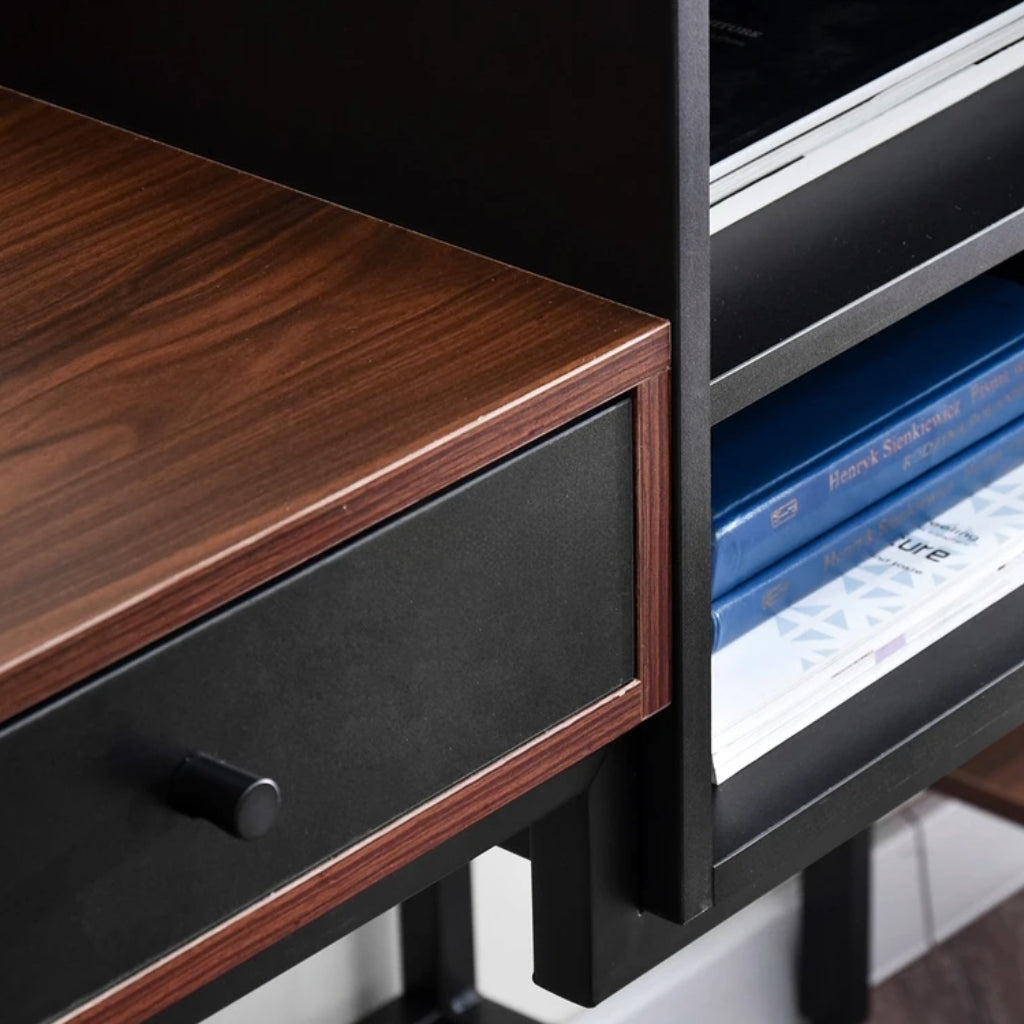 Black and brown Bloomsbury Writing Desk in a workspace drawer close up of dark brown table top and black drawer.
