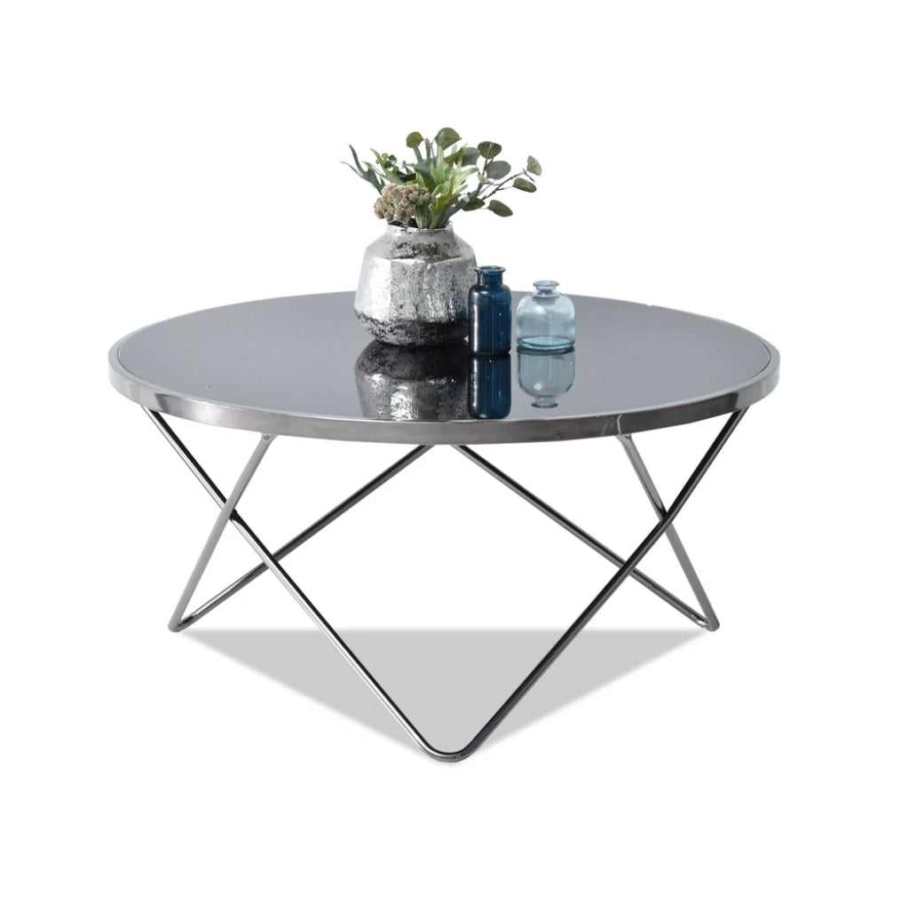 Black and silver coffee table with metal base.