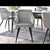 Campbell grey velvet dining chair with black legs and table.