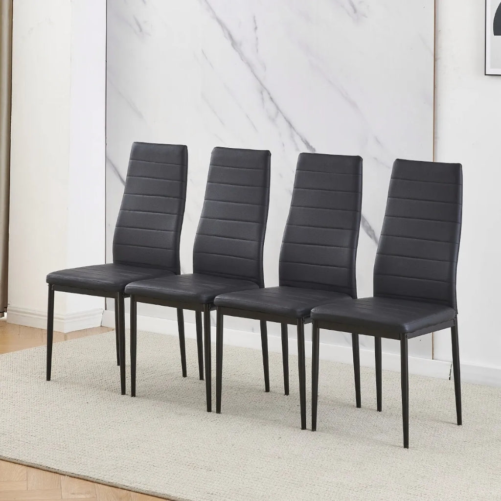 East Urban stylish black four black pu dining chairs in a room.