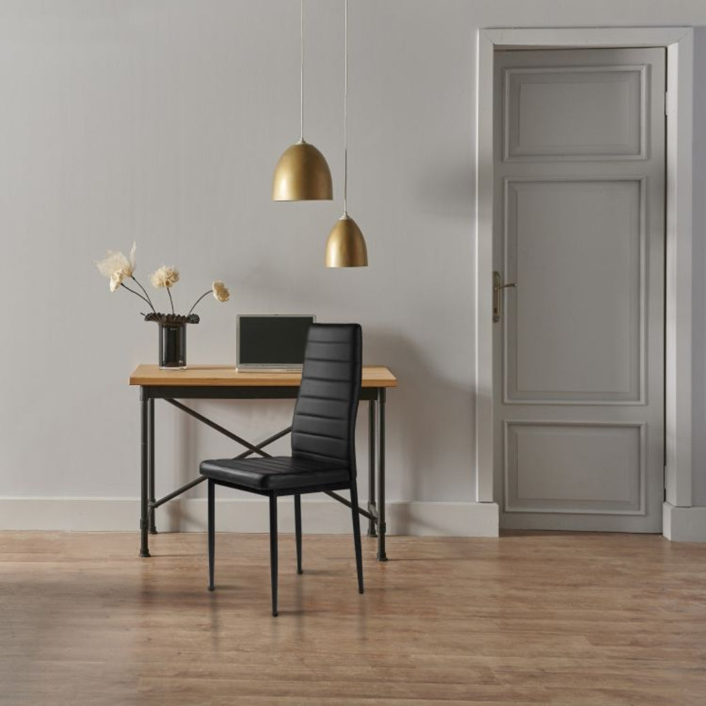 East Urban stylish black pu chairs and table in a room.