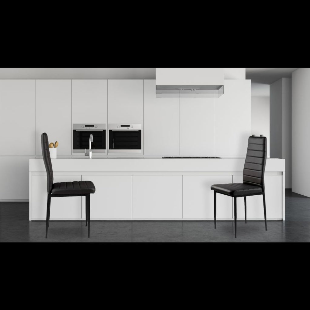 East Urban stylish black pu chairs in a modern kitchen with white cabinets.