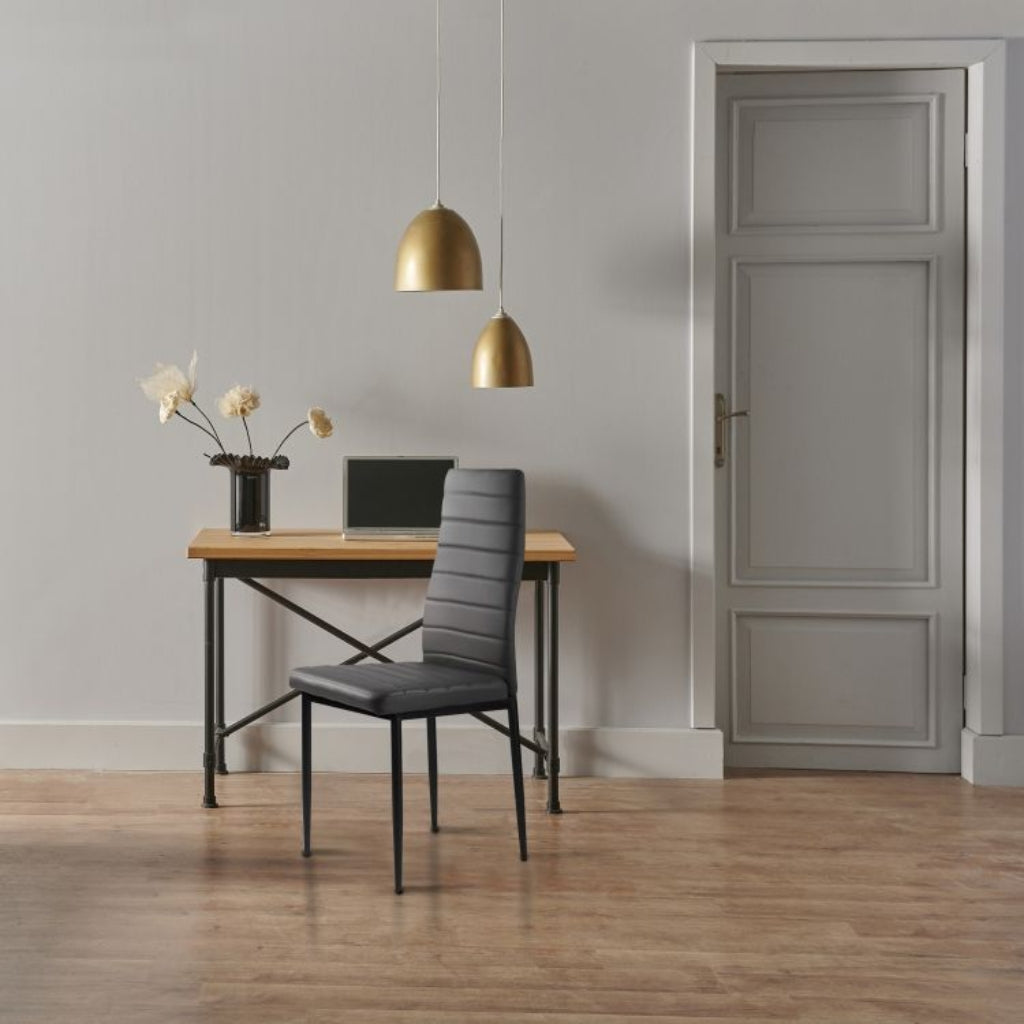 East Urban stylish dark grey pu chairs and table in a room.
