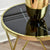 Enhance your space with the Aden Black top Gold End Table, a stunning gold metal side table with a marble top.