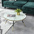 Estella white coffee table with marble top and gold legs, a modern and elegant addition to any living space.