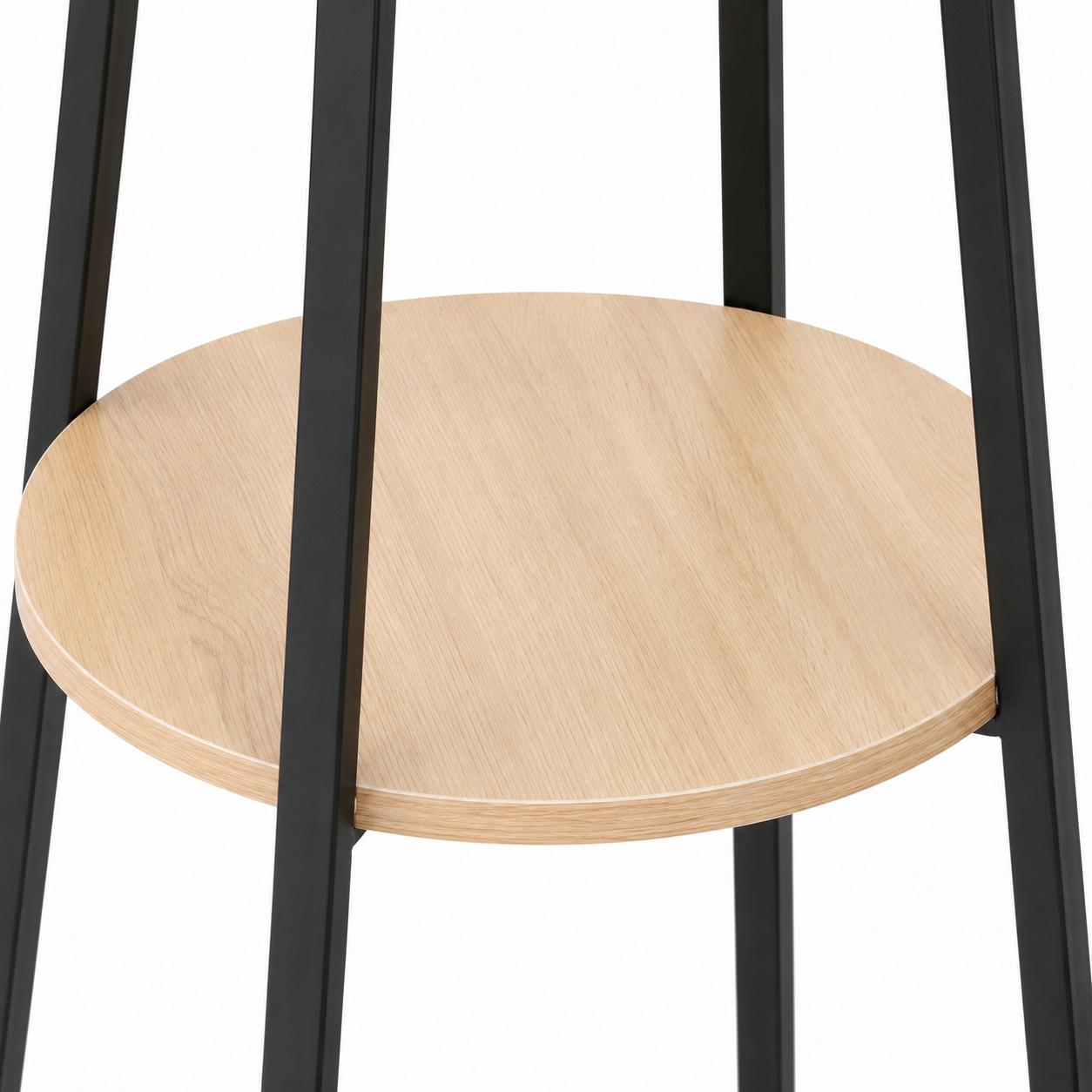 Close-up of a round light oak wood shelf supported by a black metal frame, shown against a plain white background.