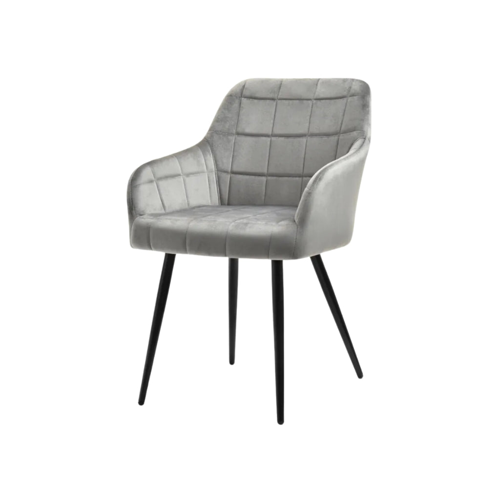 grey velvet dining chair with square tufting.