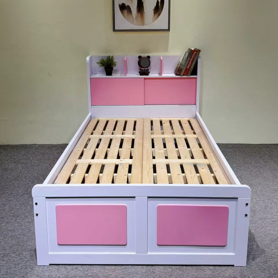 Children's bed with pink storage drawers and wooden slats on a plain floor.