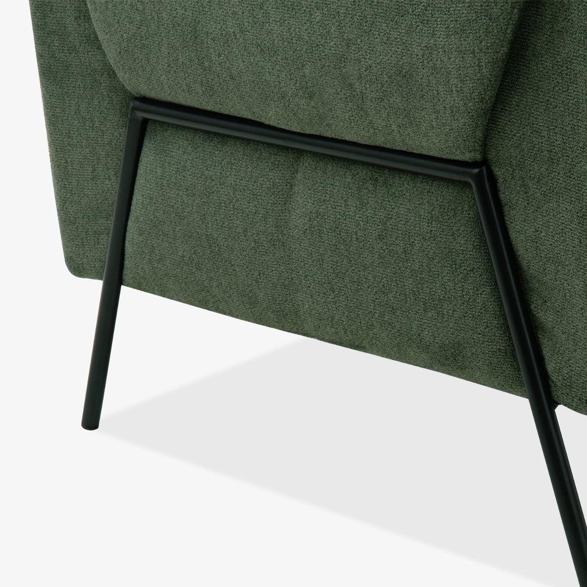 Close-up view of the black metal legs of the Kreslo Green 2-Seater Sofa.