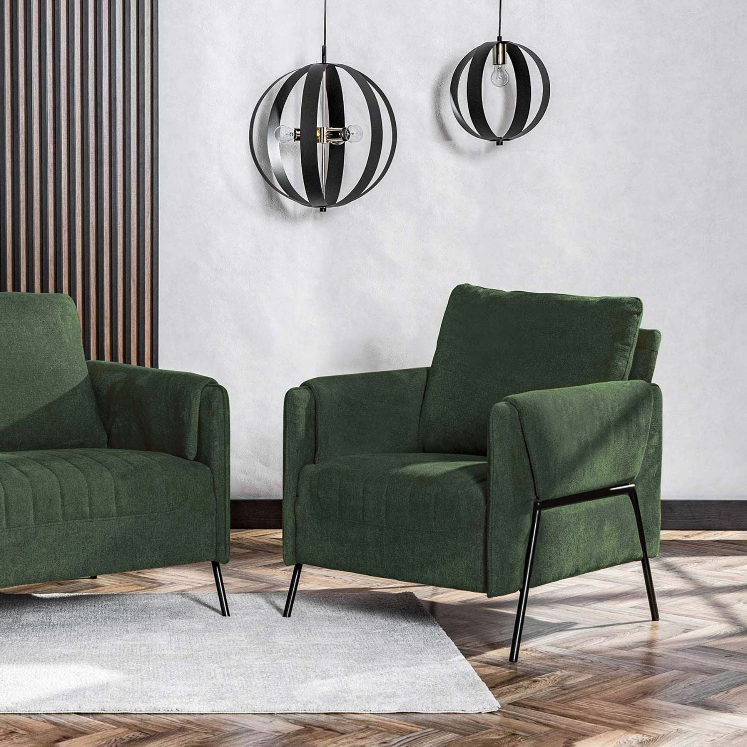 Kreslo Green Armchair and matching sofa in a modern living room interior.