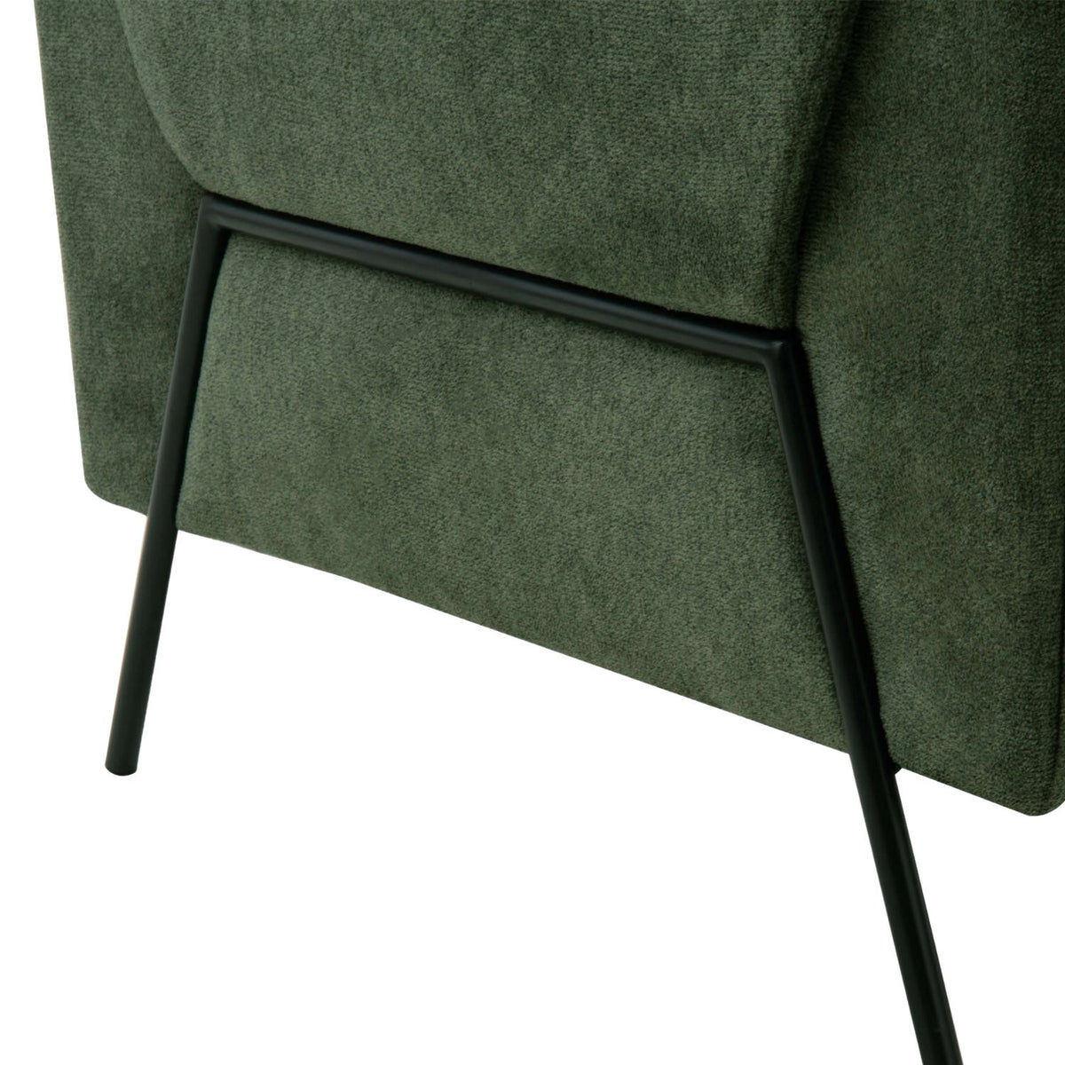 Close-up of the sleek black metal legs of the Kreslo Armchair.