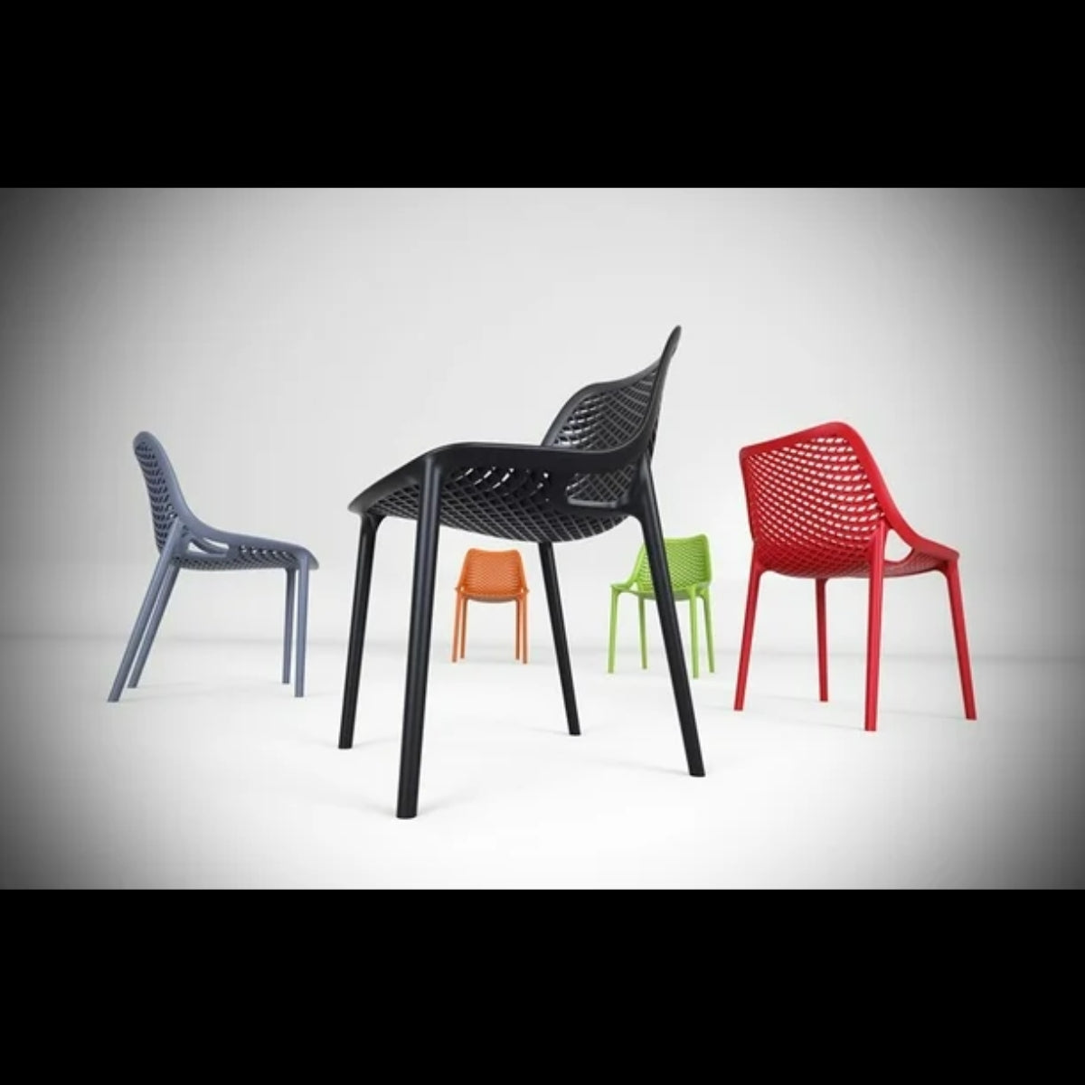 Group of Replica Bilros Chairs in various colors including black, dark grey, red, and green