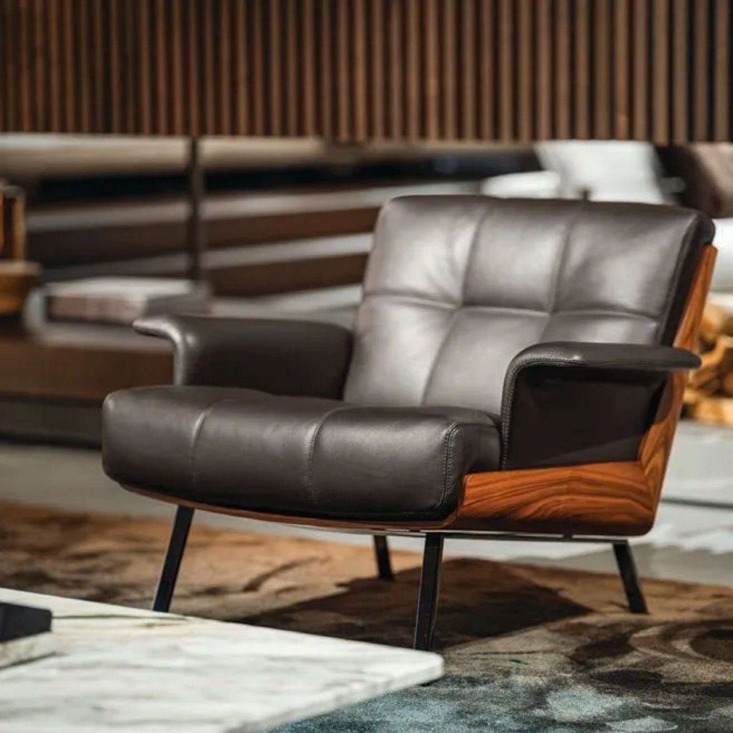 Replica Daiki sleek black leather lounge armchair in contemporary space. 