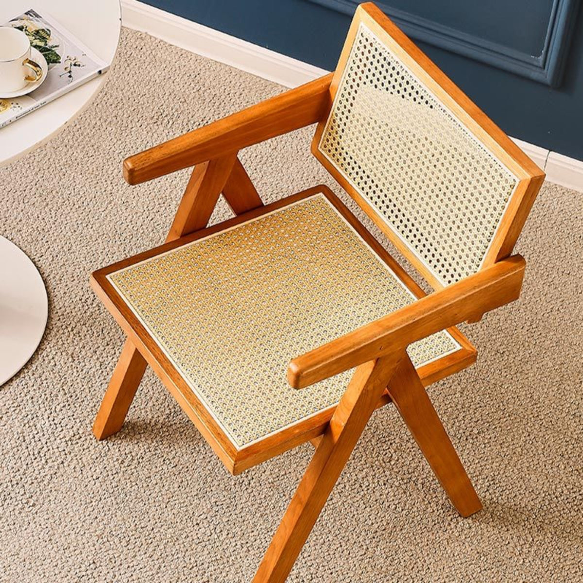 replica jeanneret armchair rattan and solid wood brown top view