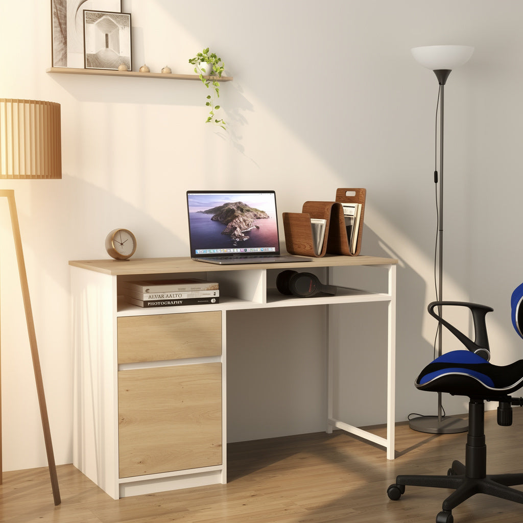 A modern white and light wood desk with a two-drawer cabinet, styled in a bright home office setting with a laptop, lamp, and office chair.