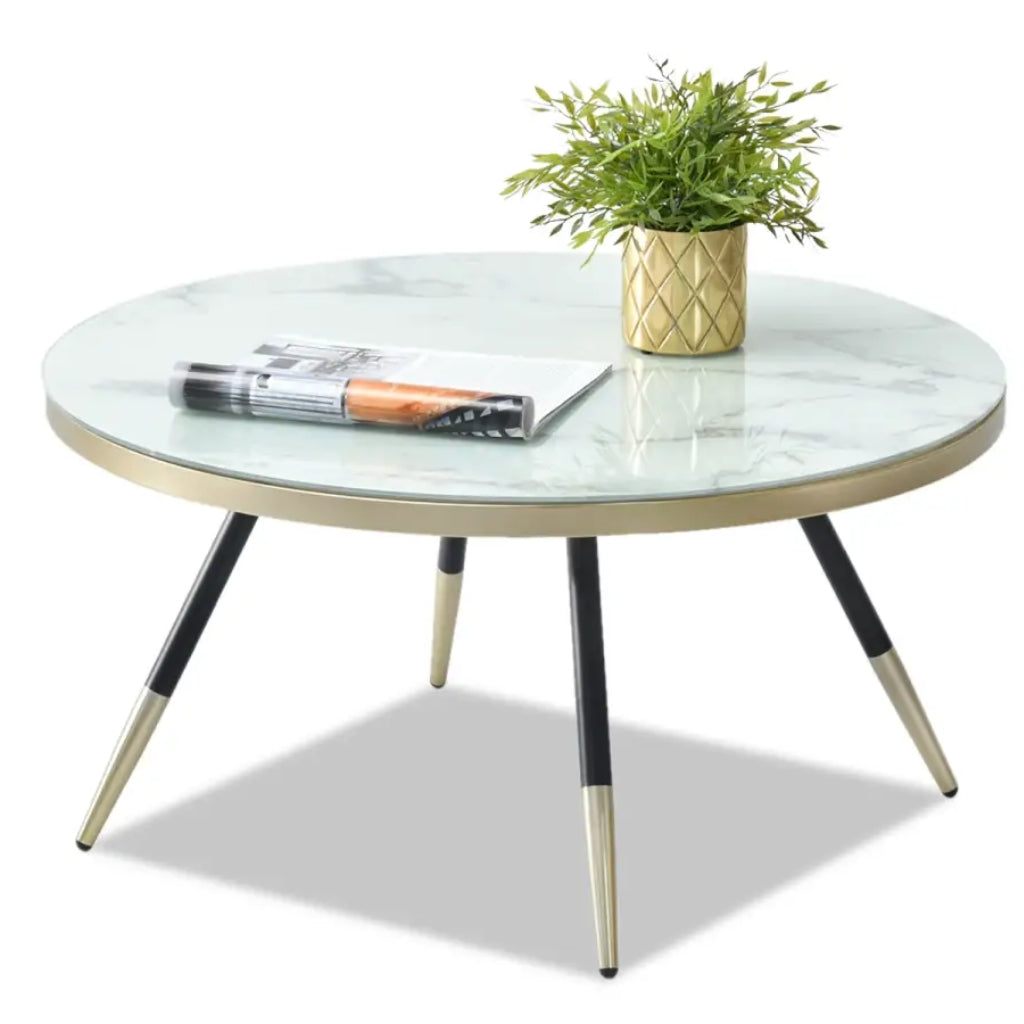 Sleek Estella white coffee table featuring a marble top and stylish gold legs, perfect for contemporary interiors.